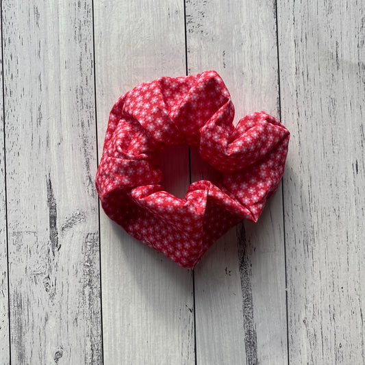 Pink daisy on a cute red background fabric. Handmade scrunchie made by zabel designs. 
